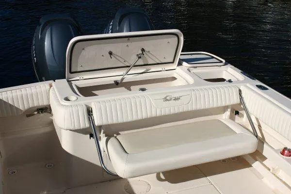 Slide: The Image of 2012 Grady-White Freedom 275 boat docked in a sunny marina setting. - 5