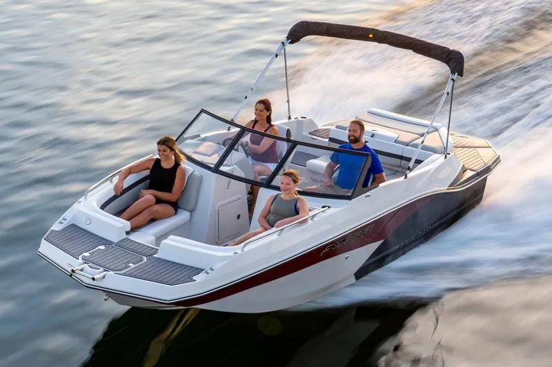 Slide: The Image of Starcraft SVX 231 IO 2026 boat with four people on water. - 6