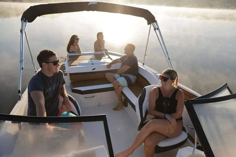 Slide: The Image of People relaxing on a 2026 Starcraft SVX 231 IO boat. - 8