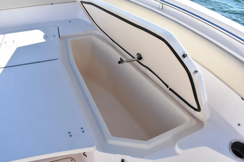Slide: The Image of Open storage compartment on 2004 Grady-White Release 283 boat deck. - 18