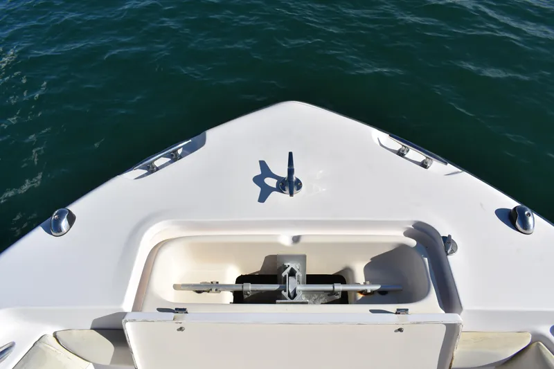 Slide: The Image of Bow of 2004 Grady-White Release 283 boat with anchor compartment, on calm water. - 20