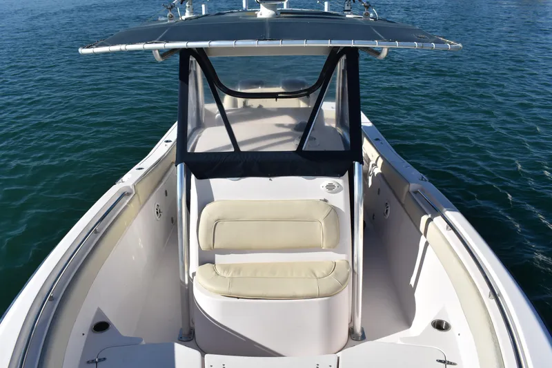 Slide: The Image of 2004 Grady-White Release 283 boat with seating, on calm water. - 21