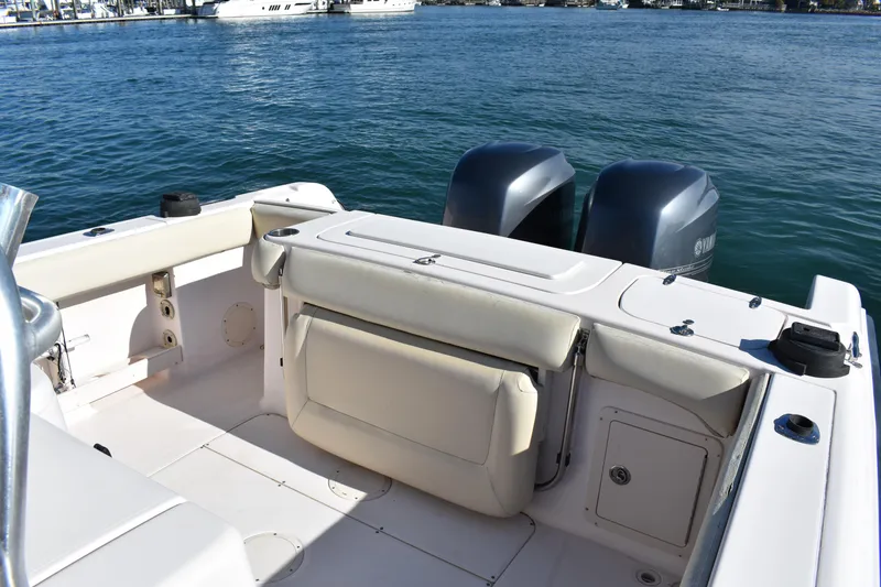 Slide: The Image of 2004 Grady-White Release 283 boat with twin outboard motors on calm water. - 22