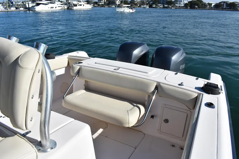 Slide: The Image of 2004 Grady-White Release 283 boat with dual engines on calm water. - 23