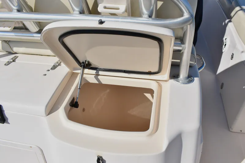 Slide: The Image of Open storage compartment on a 2004 Grady-White Release 283 boat. - 26