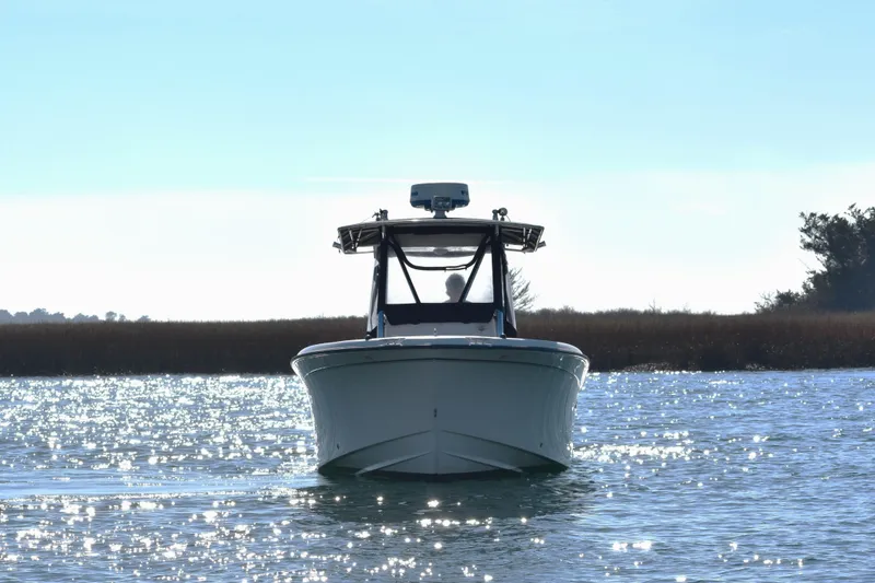 The Image of 2004 Grady-White Release 283 boat on sparkling water, front view. - 8