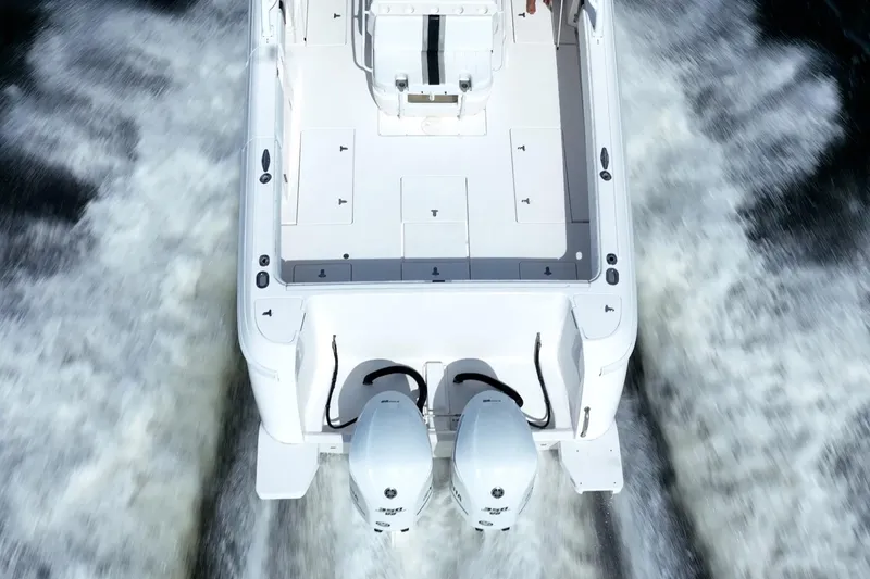 Slide: The Image of 2011 Intrepid 400 Center Console boat cruising with dual engines. - 10