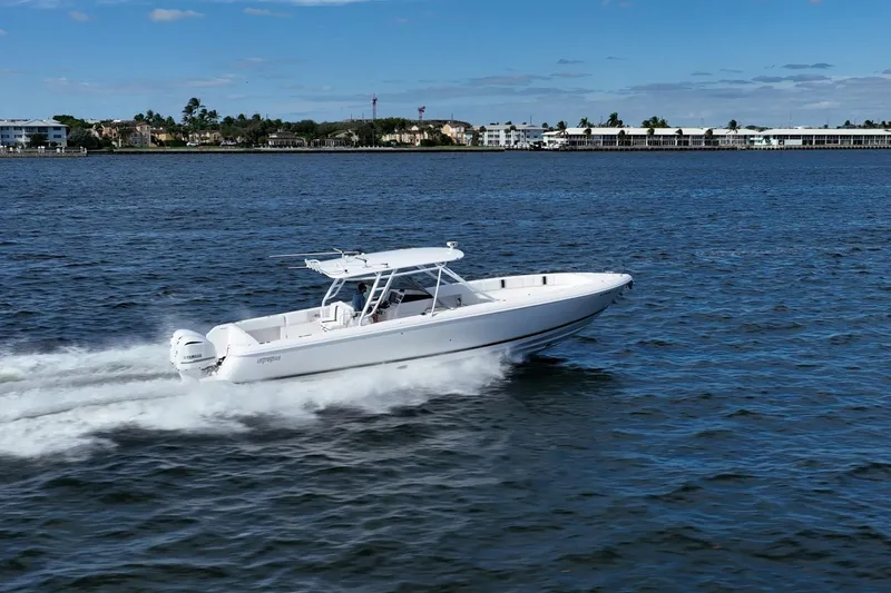 Slide: The Image of 2011 Intrepid 400 Center Console boat cruising on open water. - 11