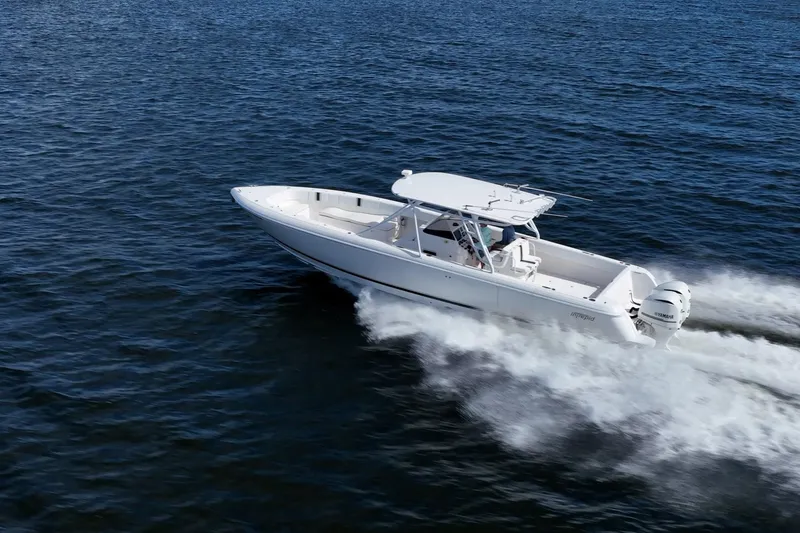 Slide: The Image of 2011 Intrepid 400 Center Console boat cruising on open water. - 14