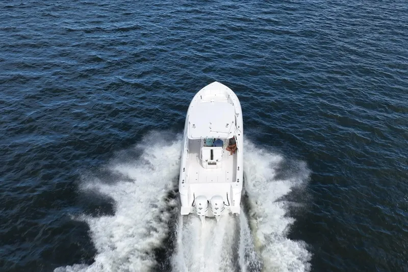 Slide: The Image of 2011 Intrepid 400 Center Console boat cruising on open water, aerial view. - 17