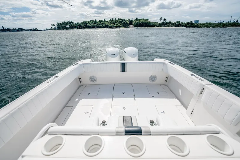 Slide: The Image of 2011 Intrepid 400 Center Console boat on water, spacious deck, island in background. - 22