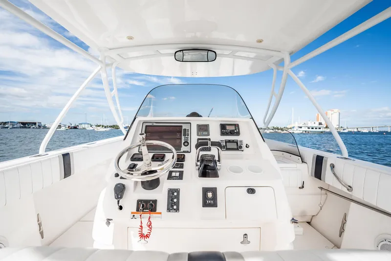 Slide: The Image of 2011 Intrepid 400 Center Console boat interior with steering wheel and control panel. - 24