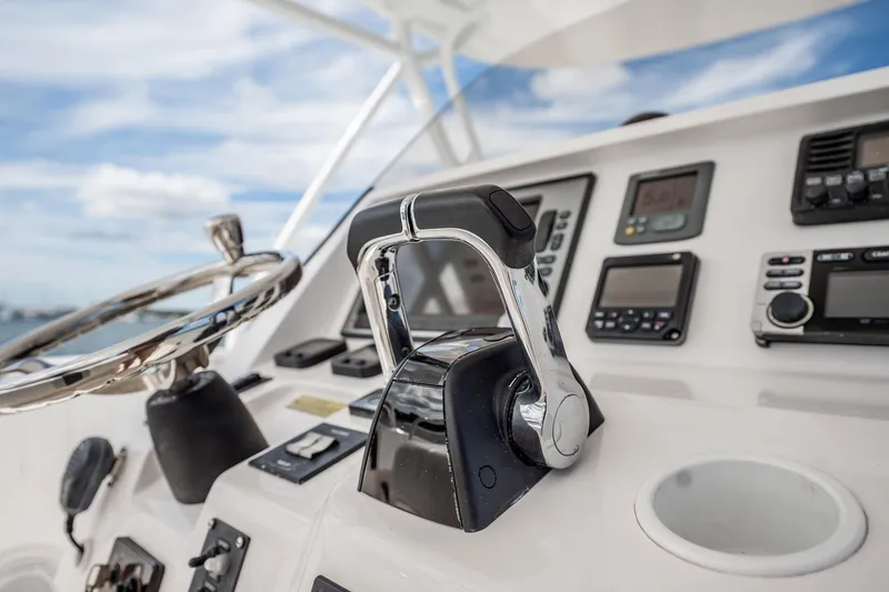 Slide: The Image of Close-up of 2011 Intrepid 400 Center Console boat controls and steering wheel. - 25