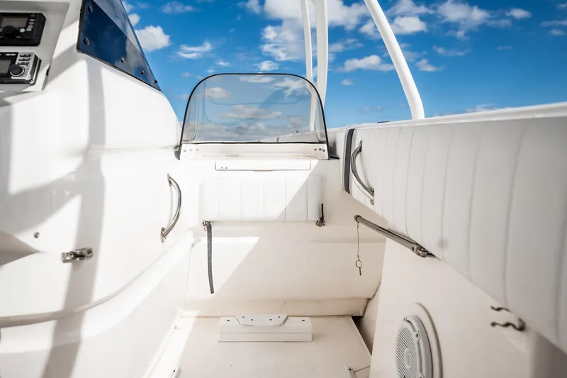 Slide: The Image of 2011 Intrepid 400 Center Console interior with white seating and blue sky background. - 26