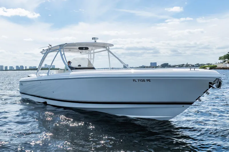 Slide: The Image of 2011 Intrepid 400 Center Console boat cruising on a sunny day. - 5