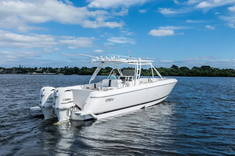 Slide: The Image of 2011 Intrepid 400 Center Console boat cruising on a sunny day. - 8