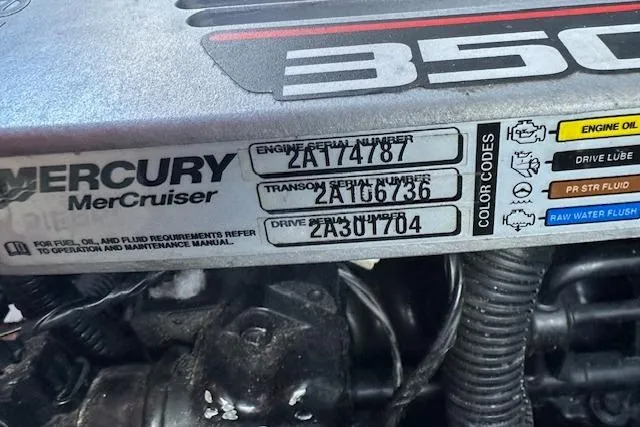 Slide: The Image of Close-up of a 2014 Rinker 260 Express Cruiser's Mercury MerCruiser engine serial numbers. - 25