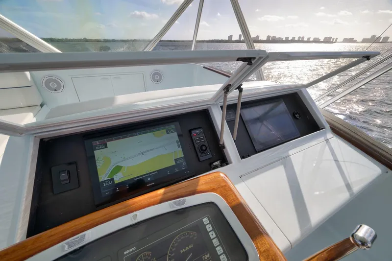 Slide: The Image of Cockpit view of 1997 Garlington 61 yacht with navigation screens and ocean backdrop. - 20