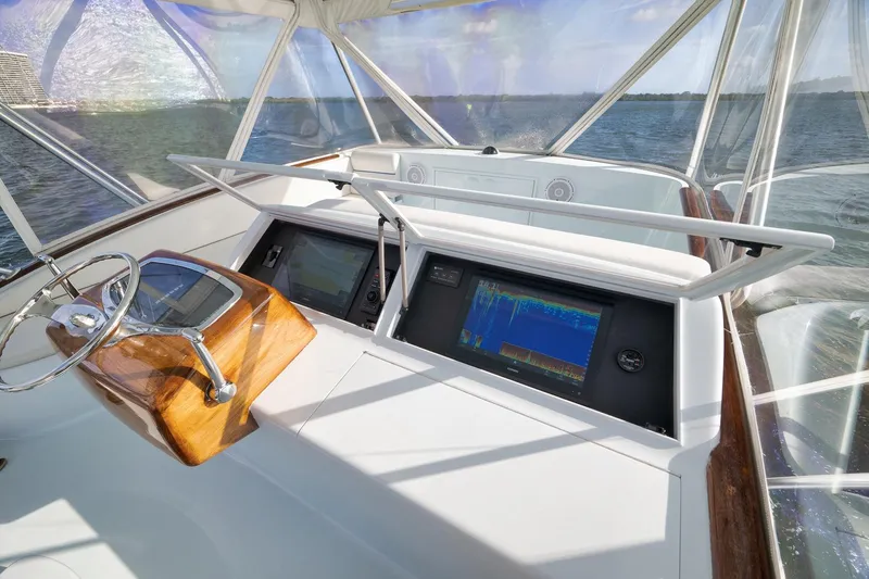 Slide: The Image of Helm of 1997 Garlington 61 yacht with navigation screens and wooden steering wheel. - 21