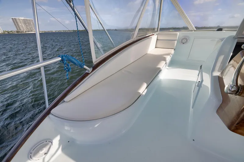 Slide: The Image of Luxurious 1997 Garlington 61 yacht interior with cushioned seating and ocean view. - 23