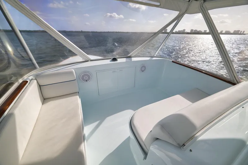 Slide: The Image of Luxurious 1997 Garlington 61 yacht interior with white seating, overlooking serene ocean view. - 24