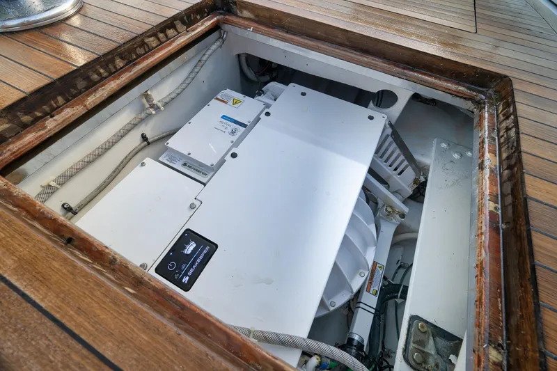 Slide: The Image of Engine compartment of a 1997 Garlington 61 yacht, showcasing mechanical components. - 37