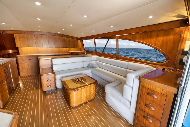 Slide: The Image of Luxurious 1997 Garlington 61 yacht interior with elegant wood finish and plush seating. - 42