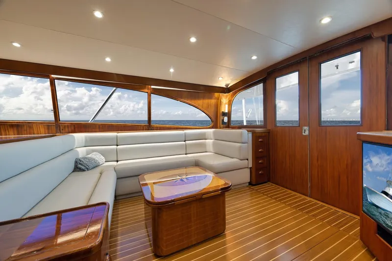Slide: The Image of Luxurious 1997 Garlington 61 yacht interior with elegant wood finish and plush seating. - 43