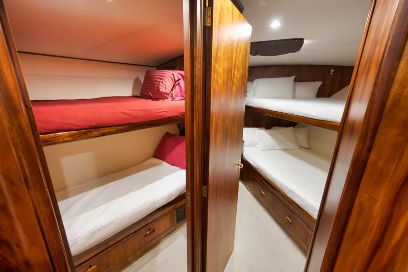 Slide: The Image of Luxurious wooden bunk beds in a 1997 Garlington 61 yacht cabin. - 52