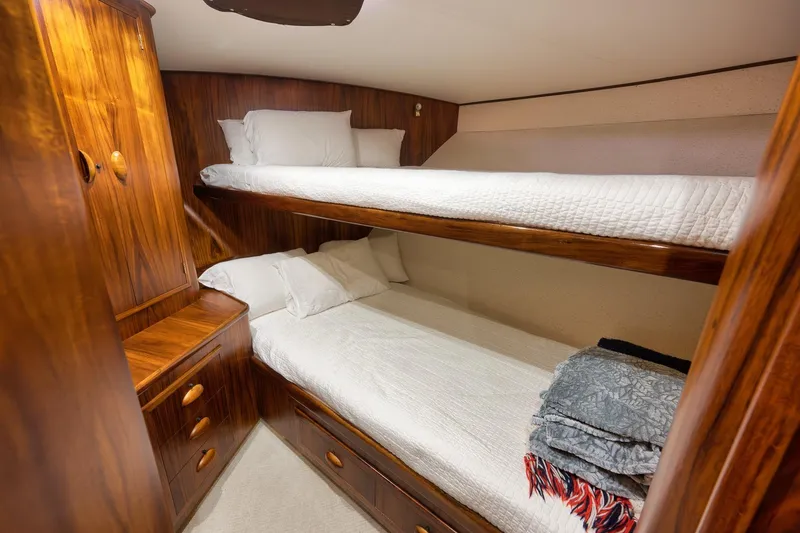 Slide: The Image of Cozy wooden bunk beds in a 1997 Garlington 61 yacht cabin. - 53