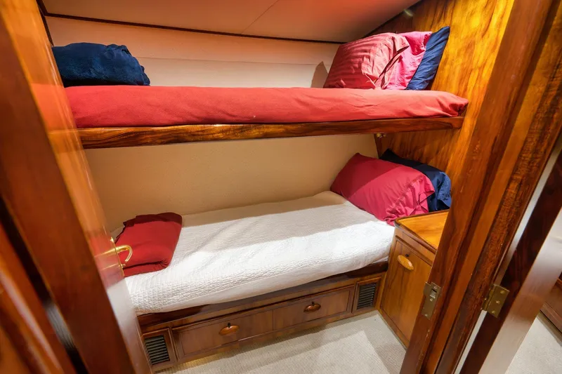 Slide: The Image of Cozy wooden bunk beds in a 1997 Garlington 61 yacht cabin. - 54
