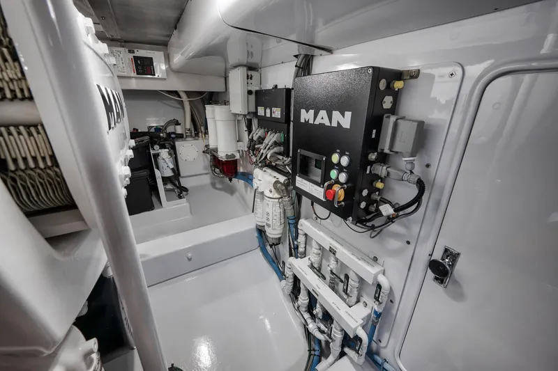 Slide: The Image of Engine room of 1997 Garlington 61 yacht with MAN control panel and equipment. - 65
