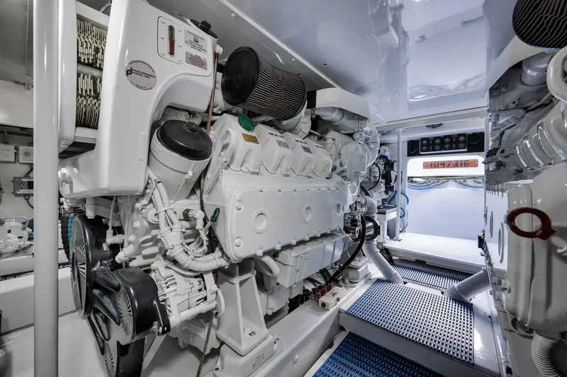 Slide: The Image of Engine room of a 1997 Garlington 61 yacht, showcasing clean, organized machinery. - 66