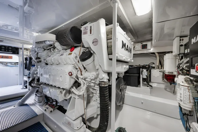 Slide: The Image of Engine room of a 1997 Garlington 61 yacht featuring a MAN engine. - 67