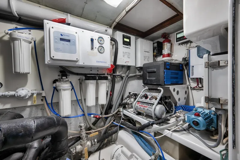 Slide: The Image of Engine room of 1997 Garlington 61 yacht with water filtration and control systems. - 68