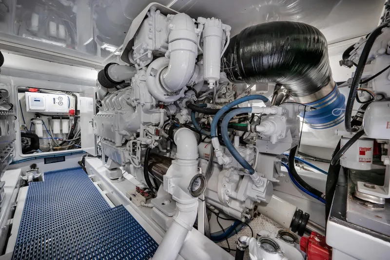 Slide: The Image of Engine room of a 1997 Garlington 61 yacht, showcasing complex machinery and components. - 69