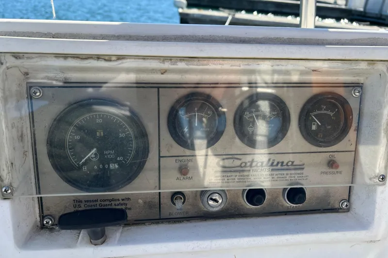 Slide: The Image of Control panel of a 1986 Catalina 30 MkII yacht with gauges and switches. - 7