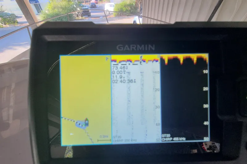 Slide: The Image of Garmin GPS display on 2002 Pro-Line 22 Sport boat, showing navigation and sonar data. - 11