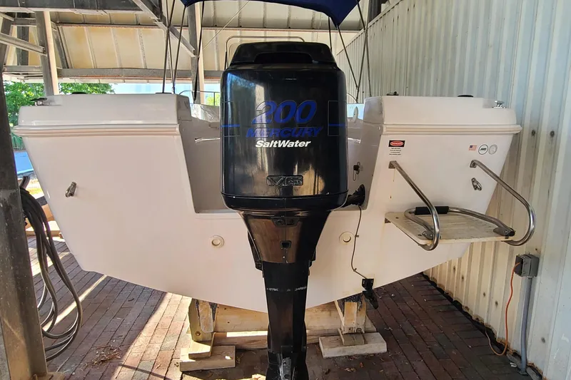 Slide: The Image of 2002 Pro-Line 22 Sport boat with Mercury 200 Saltwater outboard engine. - 22