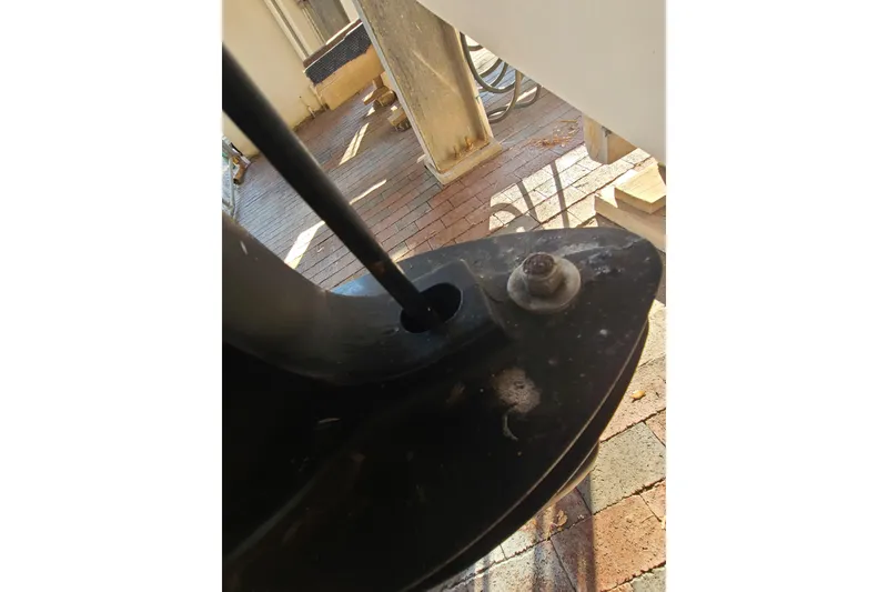 Slide: The Image of Close-up of a 2002 Pro-Line 22 Sport boat component on a brick surface. - 28