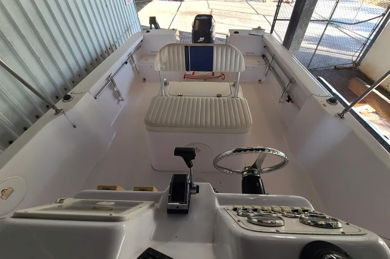 Slide: The Image of 2002 Pro-Line 22 Sport boat interior with steering wheel and seating. - 8