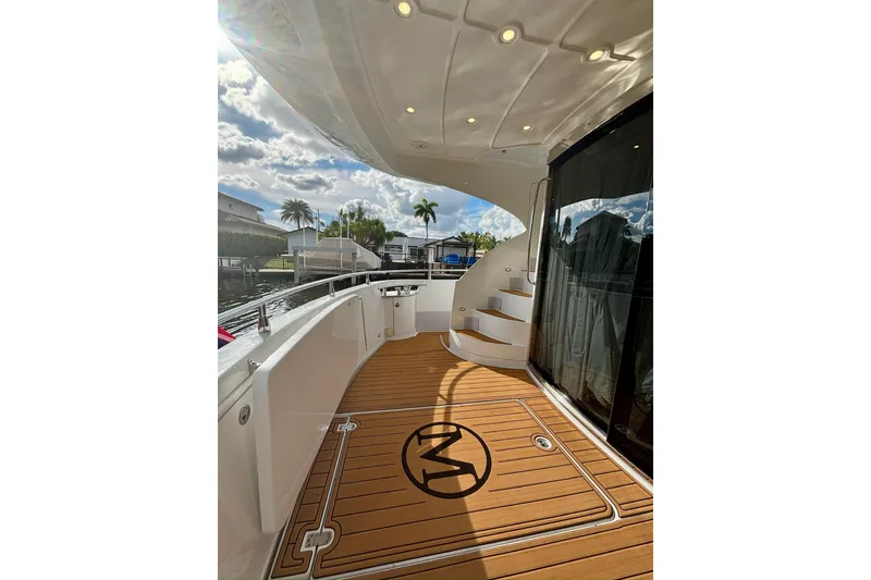 Slide: The Image of Luxurious 2004 Marquis 59 yacht deck with elegant wood flooring and modern design. - 11