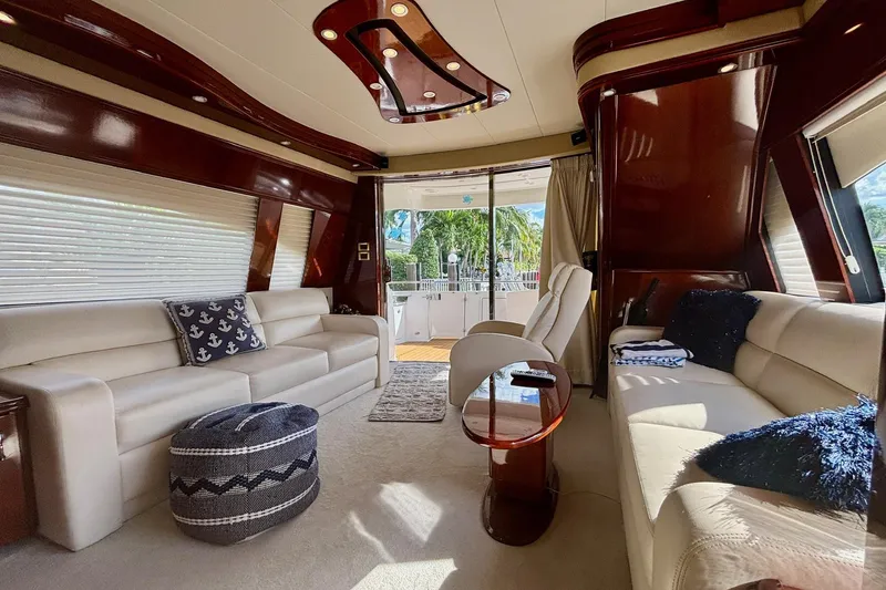 Slide: The Image of Luxurious 2004 Marquis 59 yacht interior with elegant seating and modern design elements. - 19