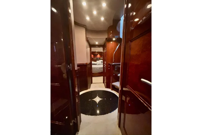 Slide: The Image of Luxurious interior of a 2004 Marquis 59 yacht with polished wood and elegant lighting. - 27