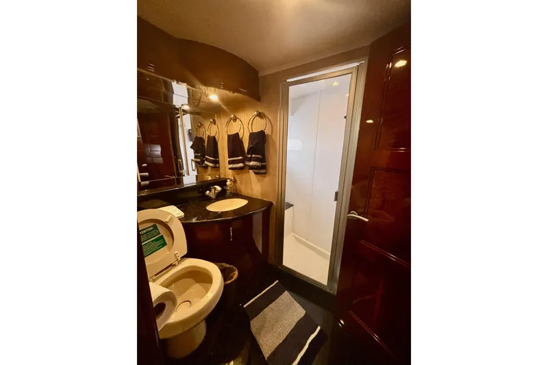 Slide: The Image of Luxurious bathroom in 2004 Marquis 59 yacht with modern fixtures and elegant design. - 31