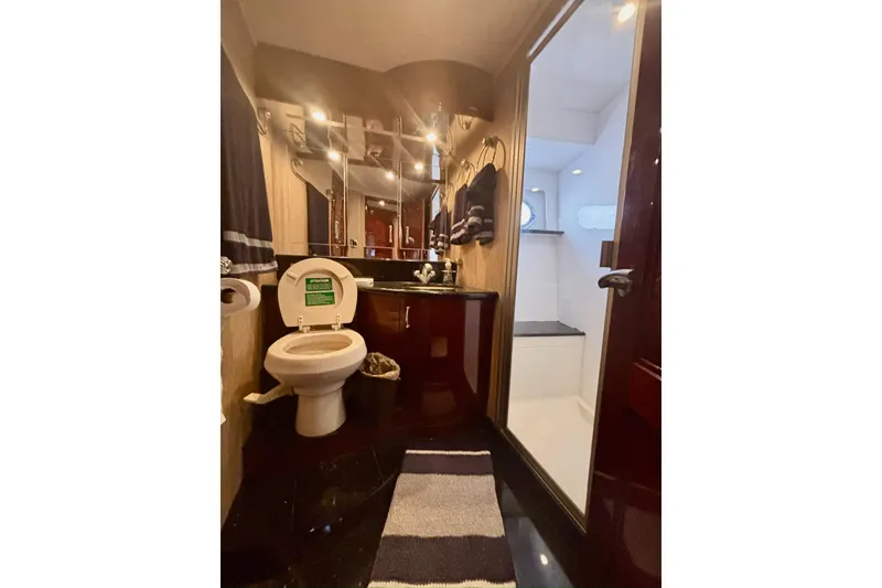 Slide: The Image of Luxurious bathroom in 2004 Marquis 59 yacht with modern fixtures and elegant design. - 32