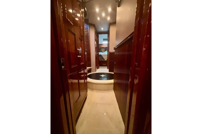 Slide: The Image of Luxurious interior hallway of 2004 Marquis 59 yacht with polished wood finishes. - 33