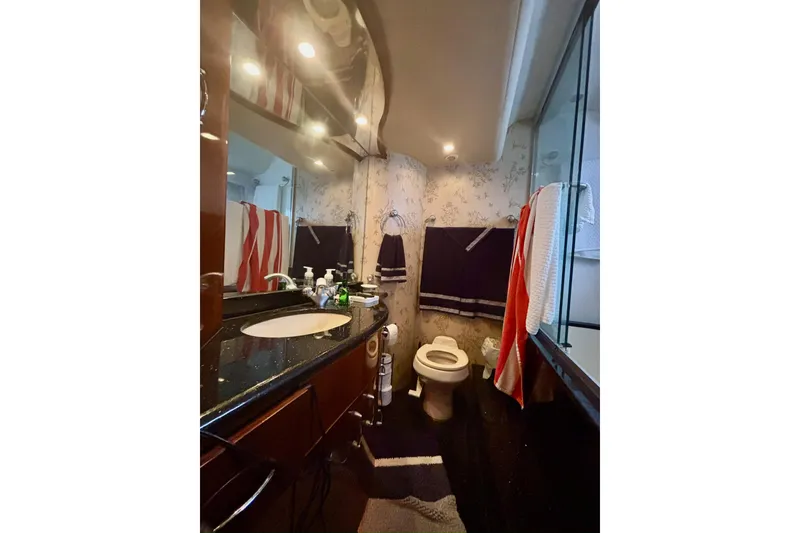 Slide: The Image of Luxurious bathroom in 2004 Marquis 59 yacht with elegant fixtures and modern design. - 37