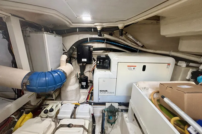 Slide: The Image of Engine room of a 2004 Marquis 59 yacht with Kohler power systems. - 38