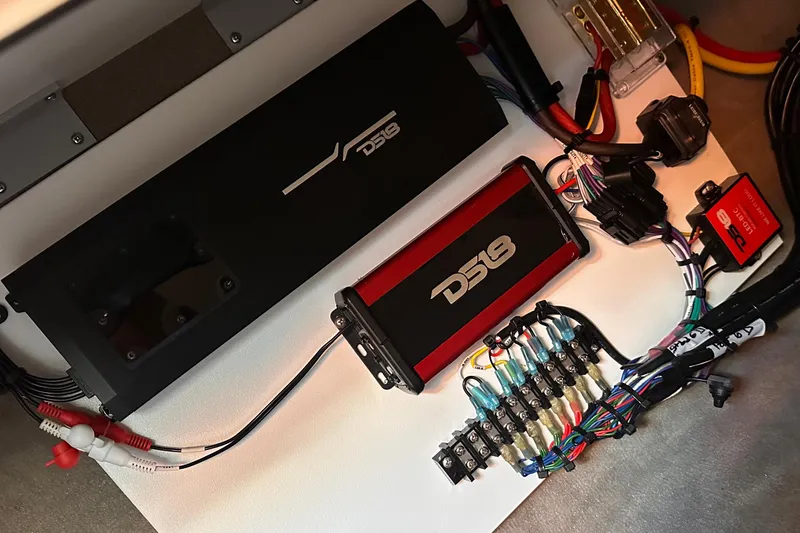 Slide: The Image of Audio system installation on a 2005 Sea Ray 320 Sundancer boat, featuring DS18 components. - 13